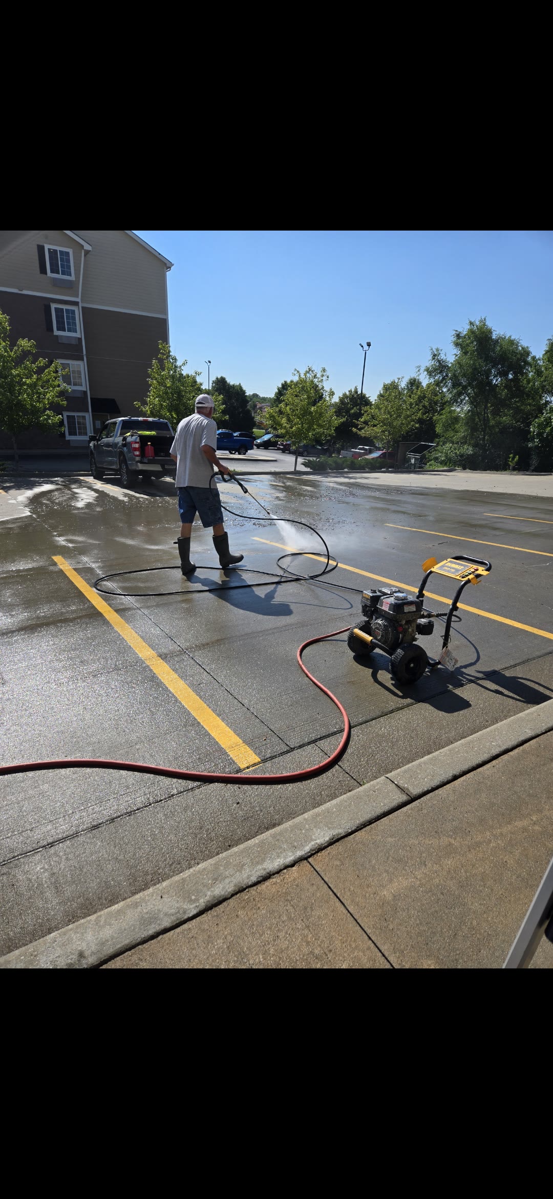 Pressure washing exterior concrete surface